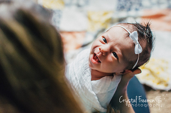I love photographing newborns in the arms of their parents. To me, this evokes more emotion than a posed bean bag shot.