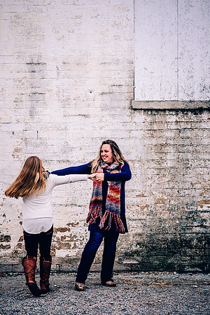 Mother and tween daughter dancing together at Harlinsdale Farms in Franklin TN