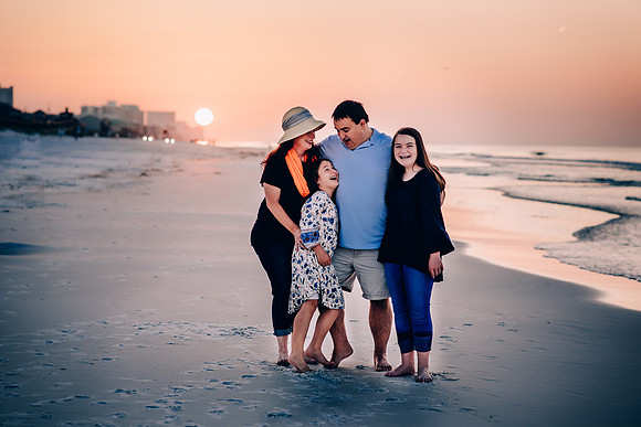 Family Of Four At The Beach
