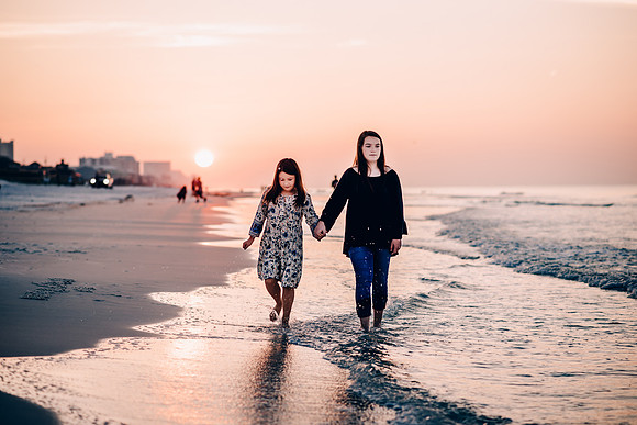 Two Sisters Walking On The Beach