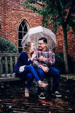 Couple Holding Umbrella At Downtown Franklin TN Portrait Session