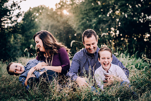 Family Of Four With Two Young Boys Giggling At Spring Hill TN Photo Session