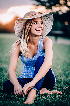 Teen girl at sunset wearing a hat for Senior Portrait Session at Henry Horton State Park